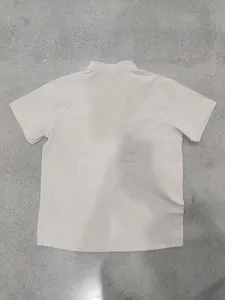 Back view of a comfortable off-white linen Henley shirt for men with short sleeves.
