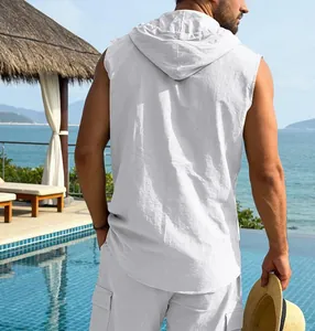 Detailed back view of a men's casual white linen hooded sleeveless shirt in resort setting