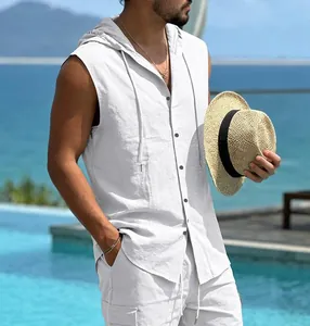Detail showing the white linen hooded sleeveless shirt's texture and drawstring hood design
