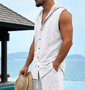 Men's white linen sleeveless hooded shirt side view shown at a sunny beach resort