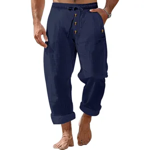 Detailed view of mens navy blue linen casual pants with drawstring and button design