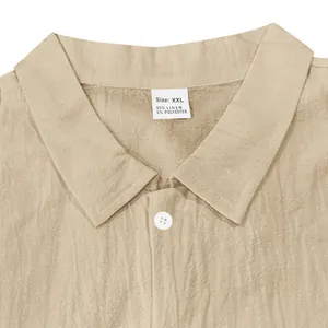 Macro view of beige linen shirt collar showing XXL size label and breathable fabric