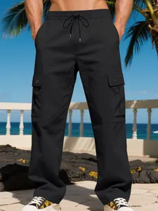Men's loose black outdoor cargo pants with drawstring waist and side pockets on beach