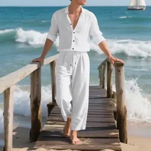 Full view of men's white linen long sleeve shirt and trousers set on a wooden beach pier