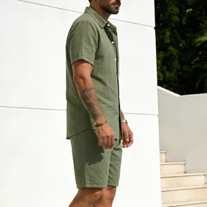 Side view of men's olive green striped linen shirt and shorts set in casual outdoor setting.