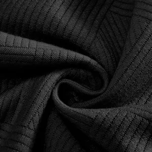 Macro detail of the heavy black jacquard fabric texture on American retro sweatshirt