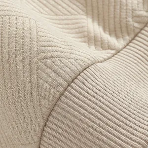 Close-up of heavyweight jacquard fabric texture on a retro American style sweatshirt.
