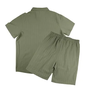 Macro view showing the olive green pinstripe texture of cotton-linen men's shorts set.