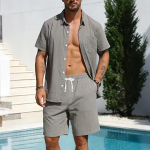 Men's grey linen striped short sleeve shirt and shorts two-piece leisure set shown by a pool