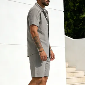 Detailed side view of men's grey striped linen short sleeve shirt and shorts set