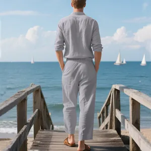 Back view of a men's linen long-sleeved shirt and pants set on a scenic beach pier.