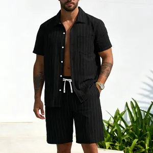 Detailed view of men's black pinstripe linen shirt and matching shorts set
