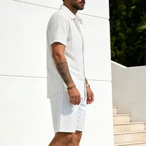 Men's casual white striped linen shirt and shorts two-piece outfit shown from a side profile