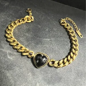 18K gold plated stainless steel Cuban link bracelet with black heart centerpiece
