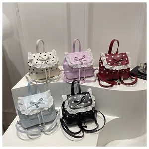 Piccoli zaini carini a pois con pizzo e fiocco disponibili in cinque colori vivaci