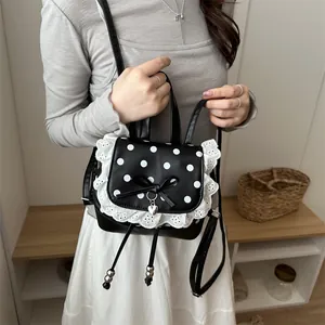 Zainetto nero con pois bianchi, pizzo elegante e un grazioso fiocco decorativo stile