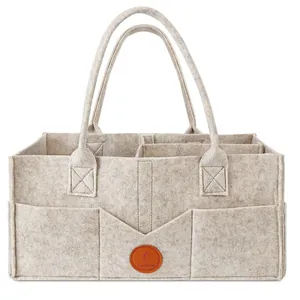 Large beige felt diaper caddy organizer with multiple compartments and sturdy handles