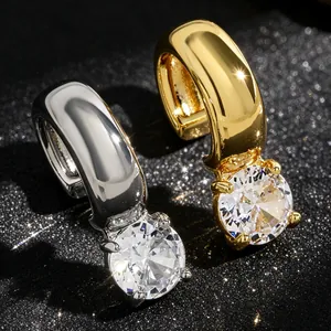 Close-up of elegant gold and silver twisted ear cuffs with sparkling round zircons