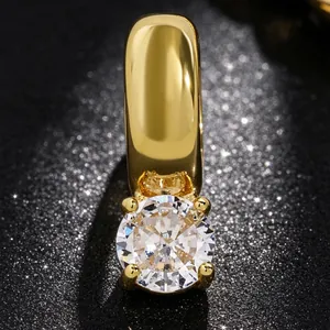 Close-up of a premium gold-toned ear cuff with a brilliant round-cut cubic zirconia