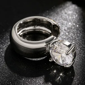 Macro detail of luxury silver ear cuff with large round-cut sparkling zircon