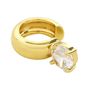 Close-up detail of a gold-plated ear cuff featuring a brilliant round zircon for non-pierced ears