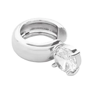 Close-up of polished silver ear cuff with a large round clear zirconia stone