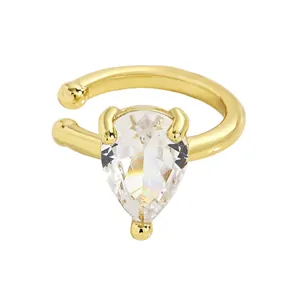 Close-up detail of the elegant pear-shaped clear zircon on a gold-plated twisted ear cuff