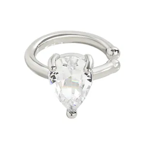 Detailed macro view of a luxury pear-shaped clear zircon ear cuff in silver plating