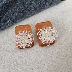 Handcrafted ethnic style wood and glass flower stud earrings with pearl details