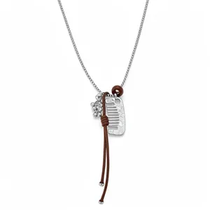 Fashionable long necklace with silver chain, brown cord knot and comb charm pendant.
