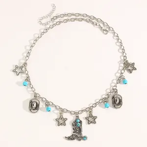 Detail view of Western style necklace with turquoise beads and cowboy boot charms
