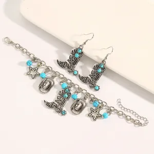 Detailed view of vintage silver Western jewelry set with turquoise cowboy boot charms