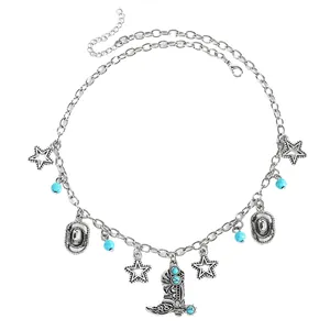 Western style silver chain necklace with cowboy boot, star charms and turquoise beads.