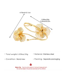 Macro view of gold hollow flower armlet showing stainless steel material and size specs