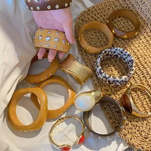 Collection of chunky geometric wooden bangles with rivets and leopard print detail