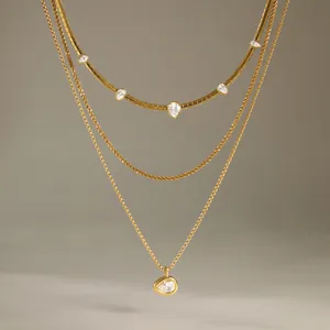 Close-up of 18k gold plated layered necklace set with sparkling waterdrop zirconia stones