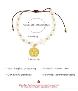 Detailed view of hand-woven rope bracelet with imitation pearls and religious charms