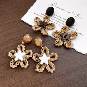 Handmade woven flower drop earrings with wooden beads and star charms for vacation style