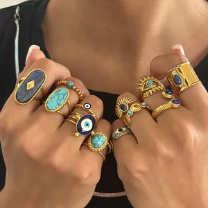 Detailed shot of vintage evil eye rings with turquoise and lapis lazuli stones.