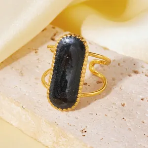Close-up of 18K gold plated titanium steel ring with large oval black druzy stone.