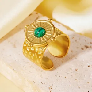 Detailed close-up view of a vintage 18K gold plated wide ring featuring a green malachite stone
