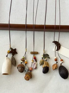 Handmade Mori style necklaces with natural wood seeds and ethnic pendant details.