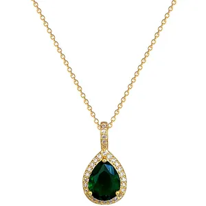Detailed view of an emerald green pear-shaped pendant necklace set in golden steel