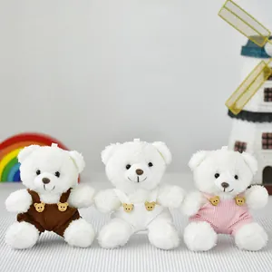 Set di tre mini ciondoli a forma di orsetto di peluche bianco con salopette colorate