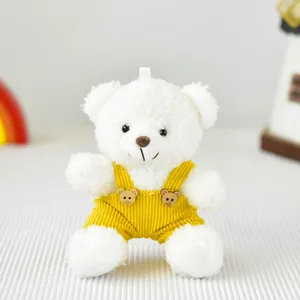 Morbido orsetto di peluche bianco con salopette di velluto giallo, ciondolo regalo