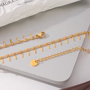 Detail view of an elegant gold-plated stainless steel necklace with delicate fringe charms