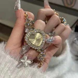 Detailed macro shot of luxury heart-shaped rhinestone watch with elegant flower bracelet