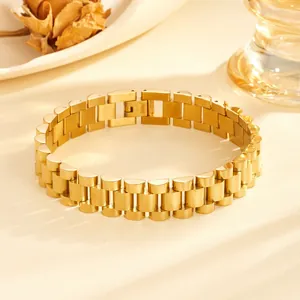 Close-up of a gold-plated fish-scale stainless steel bracelet with a secure clasp