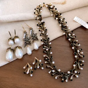 Vintage irregular geometric pearl necklace and earring set with antique gold finish