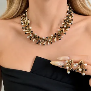 Elegant vintage irregular geometric necklace with pearl and bead accents, matching earring set